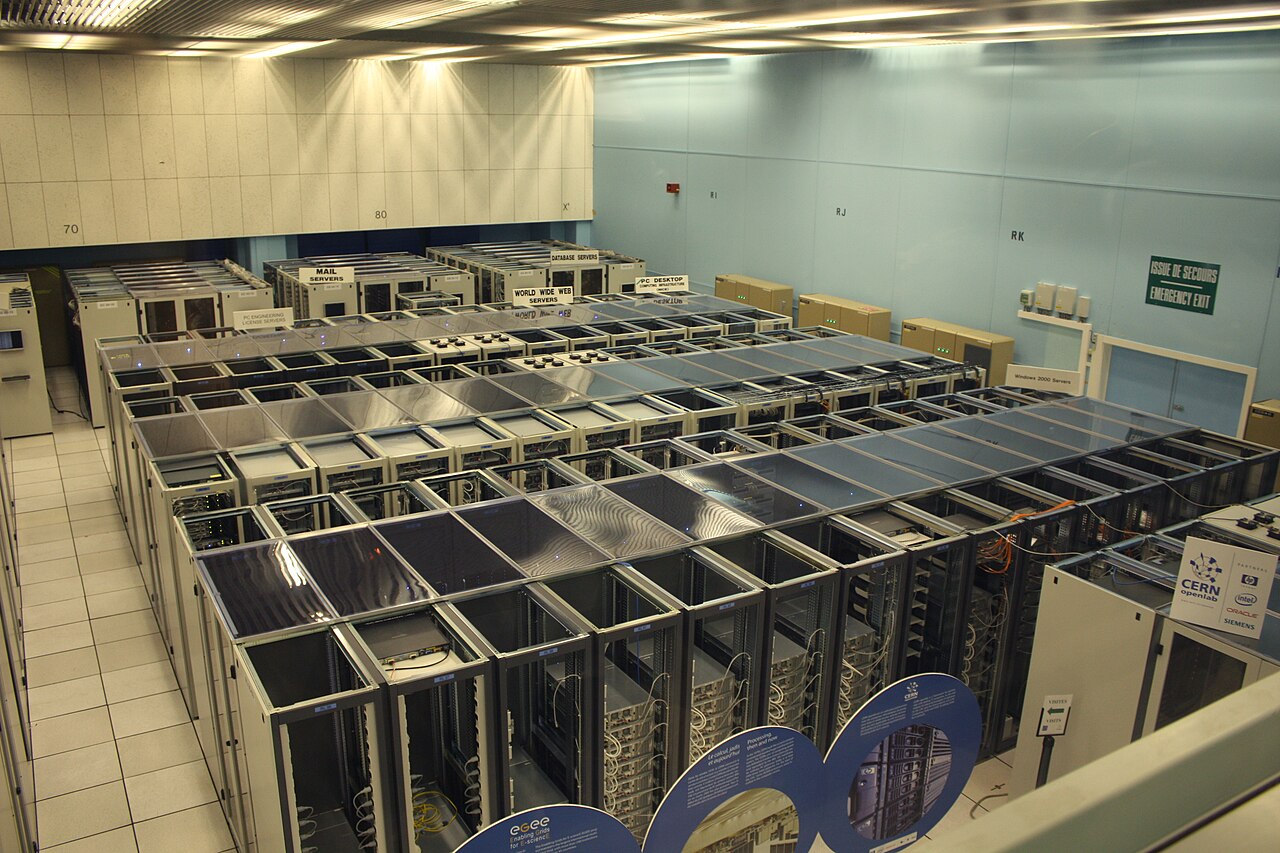 Rows of enterprise server racks and network cabling in a data center, illustrating the server infrastructure taken offline during a planned network outage for zero-day risk reduction