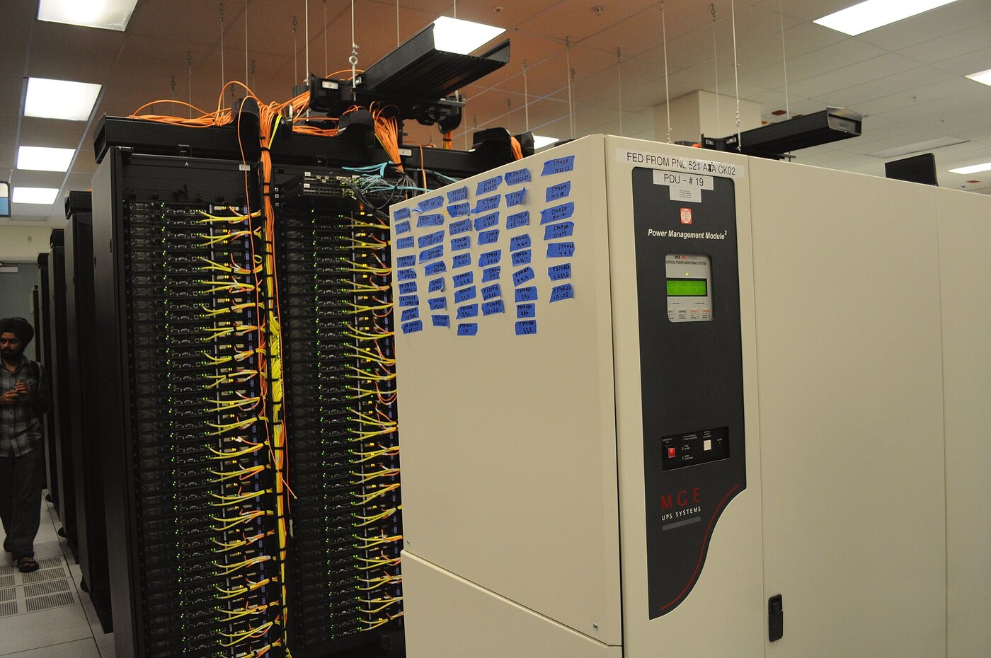 Data centre racks and network cabling representing the rented server infrastructure and cloud security exposure behind ROMULUS delivery panels