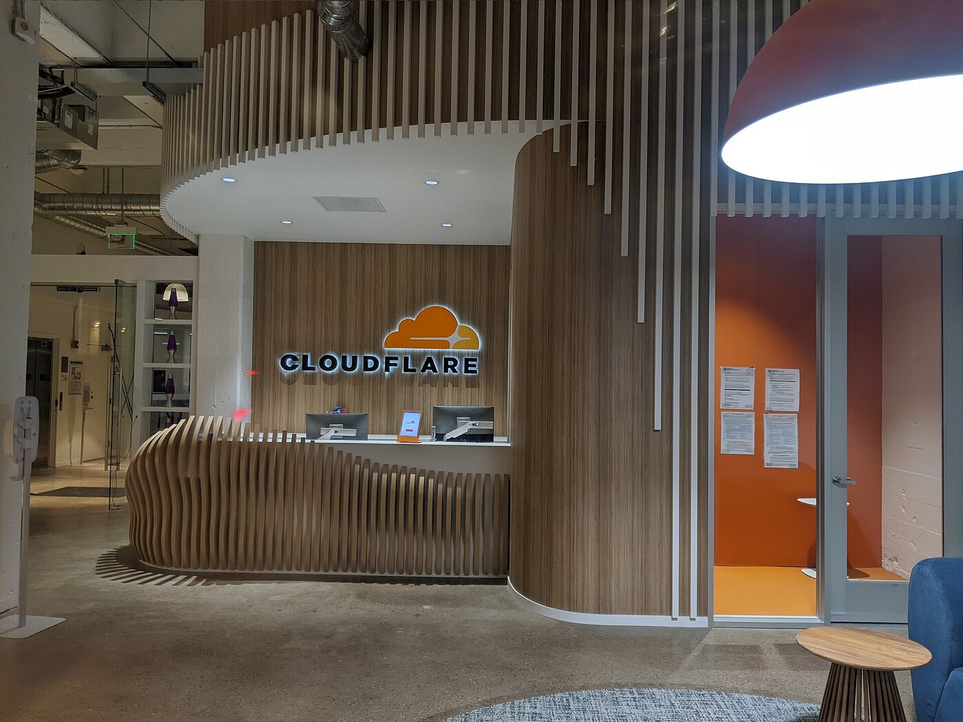 DNS security: the entrance area of a Cloudflare office, the vendor whose quiche QUIC library was patched against the QPACK HTTP/3 memory amplification flaw affecting encrypted DNS server infrastructure